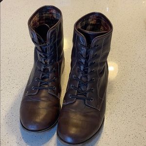 Woman’s brown combat boots